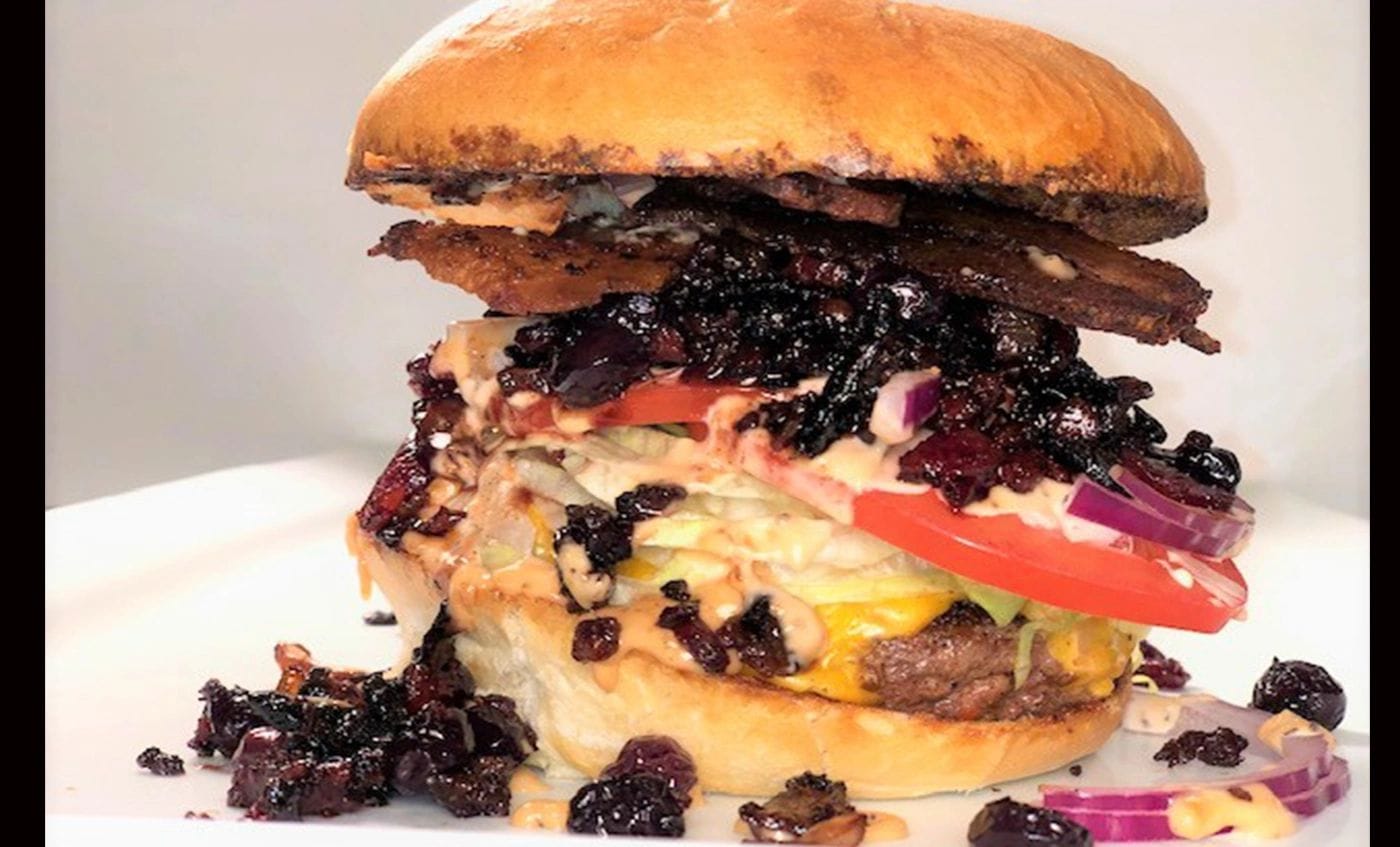 A loaded burger from Main Event Grill